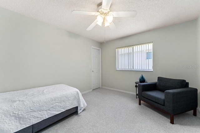 4386 Sambourne St, Clermont, FL 34711 - carpeted bedroom featuring baseboards, a ceiling fan, and a textured ceiling