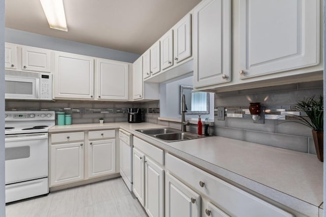 4386 Sambourne St, Clermont, FL 34711 - kitchen featuring white cabinets, a sink, and white appliances