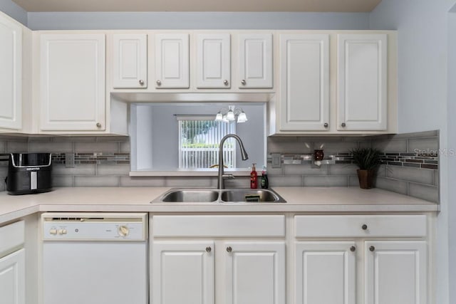 4386 Sambourne St, Clermont, FL 34711 - kitchen with white dishwasher, light countertops, white cabinetry, and a sink