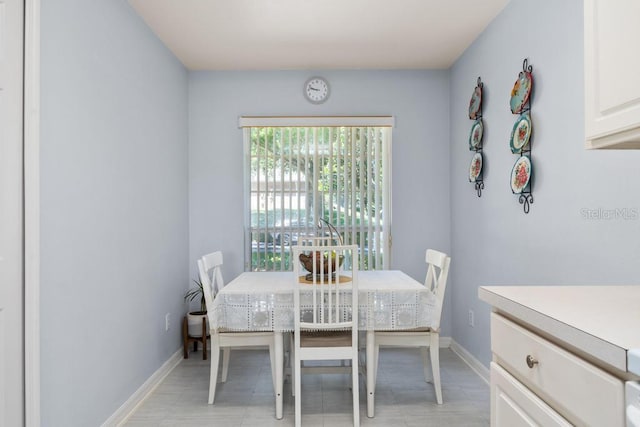 4386 Sambourne St, Clermont, FL 34711 - dining space featuring baseboards and light tile patterned flooring