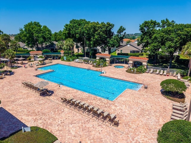 4386 Sambourne St, Clermont, FL 34711 - pool with fence and a patio area