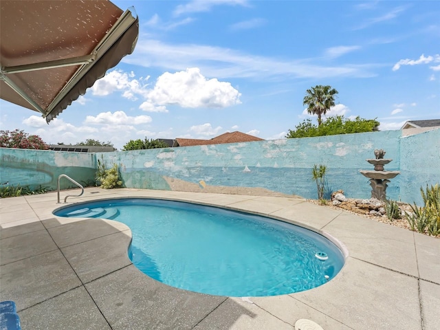 view of pool with a fenced backyard, a fenced in pool, and a patio area