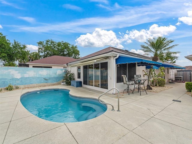 view of pool featuring a patio, a fenced in pool, and a fenced backyard