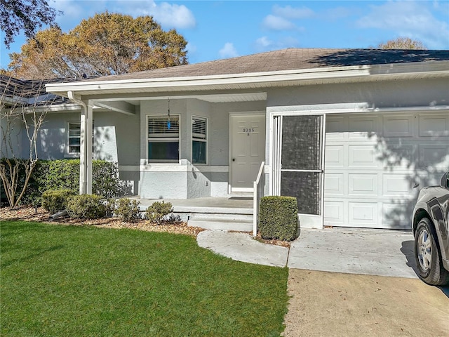 view of front of house with a garage, a shingled roof, a front lawn, and stucco siding