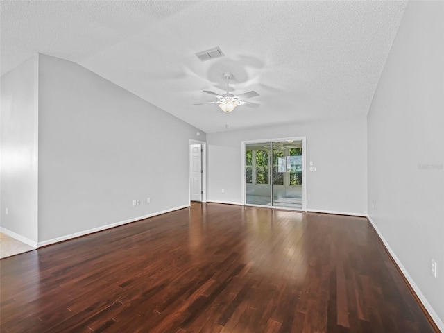 spare room featuring wood finished floors, a ceiling fan, a textured ceiling, vaulted ceiling, and baseboards