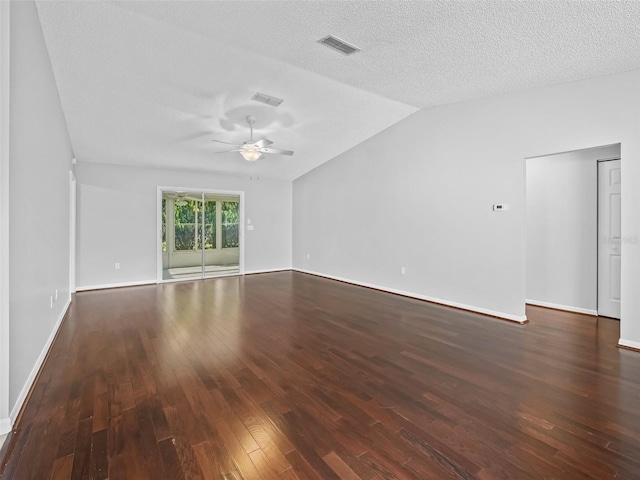 empty room featuring wood-type flooring, vaulted ceiling, ceiling fan, baseboards, and a textured ceiling