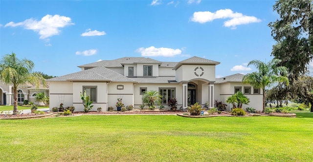 1111 Myrtle Breezes Ct, Fruitland Park, FL 34731 - mediterranean / spanish house featuring stucco siding and a front yard