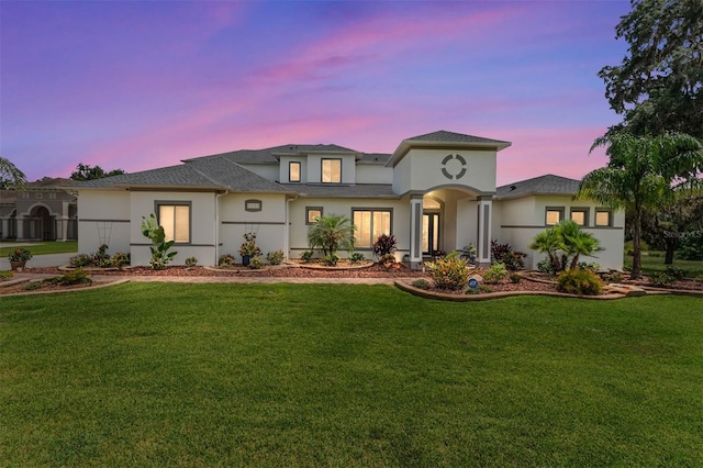 1111 Myrtle Breezes Ct, Fruitland Park, FL 34731 - view of front of property with stucco siding, a front lawn, and roof with shingles