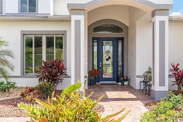 1111 Myrtle Breezes Ct, Fruitland Park, FL 34731 - property entrance with stucco siding