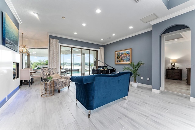 1111 Myrtle Breezes Ct, Fruitland Park, FL 34731 - living area featuring crown molding, recessed lighting, baseboards, a chandelier, and light wood-style flooring