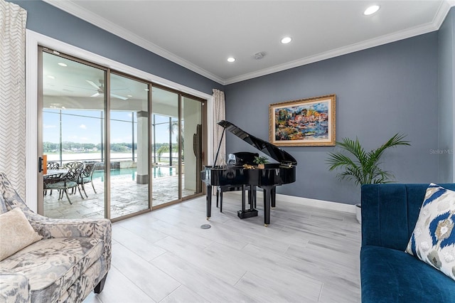 1111 Myrtle Breezes Ct, Fruitland Park, FL 34731 - living area featuring recessed lighting, baseboards, crown molding, ceiling fan, and a water view