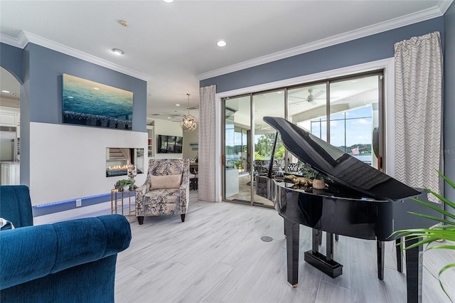 1111 Myrtle Breezes Ct, Fruitland Park, FL 34731 - living area featuring recessed lighting, ornamental molding, arched walkways, and light wood-style floors