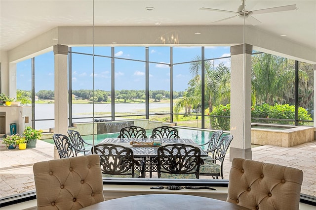 1111 Myrtle Breezes Ct, Fruitland Park, FL 34731 - sunroom / solarium featuring a jacuzzi, a water view, and view of wooded area