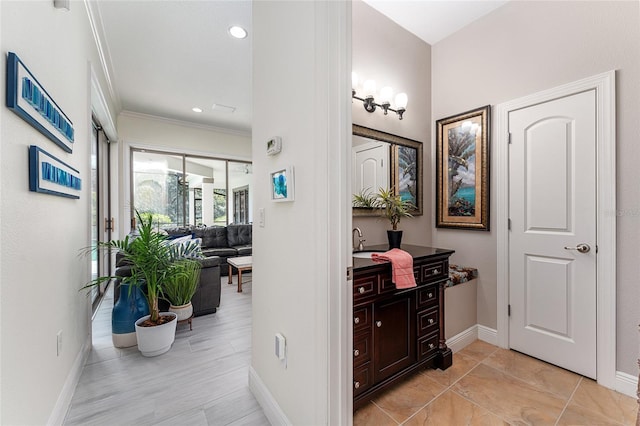 1111 Myrtle Breezes Ct, Fruitland Park, FL 34731 - bathroom featuring baseboards, ornamental molding, vanity, and recessed lighting