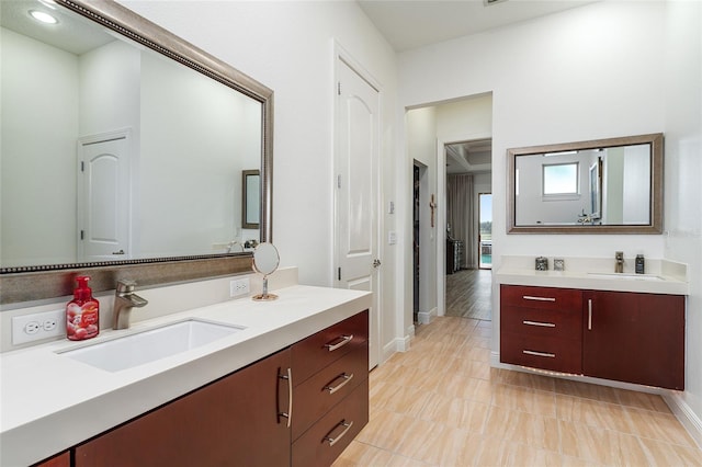 1111 Myrtle Breezes Ct, Fruitland Park, FL 34731 - bathroom with two vanities and baseboards