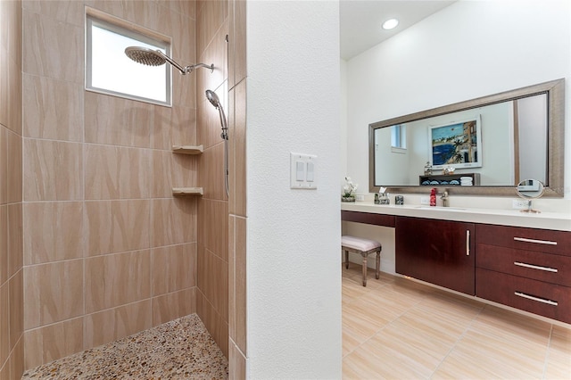 1111 Myrtle Breezes Ct, Fruitland Park, FL 34731 - full bathroom with a tile shower, vanity, tile patterned floors, and a textured wall