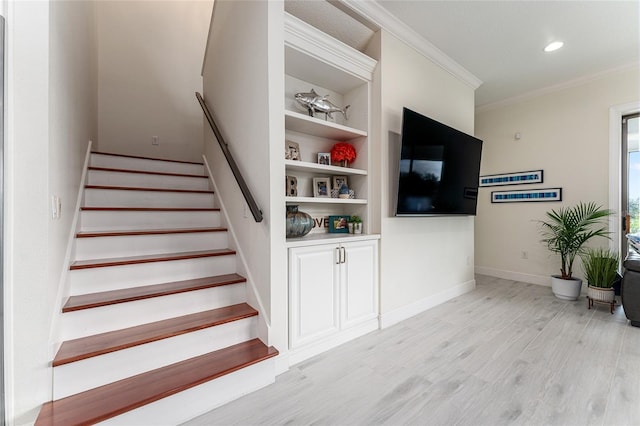 1111 Myrtle Breezes Ct, Fruitland Park, FL 34731 - stairway featuring ornamental molding, wood finished floors, baseboards, recessed lighting, and built in shelves