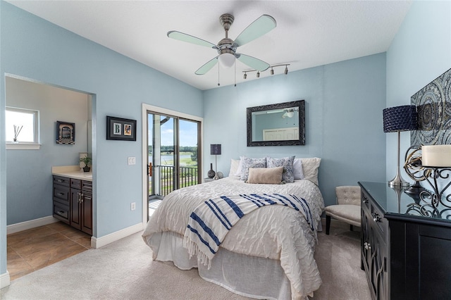 1111 Myrtle Breezes Ct, Fruitland Park, FL 34731 - bedroom featuring multiple windows, access to outside, light carpet, and baseboards