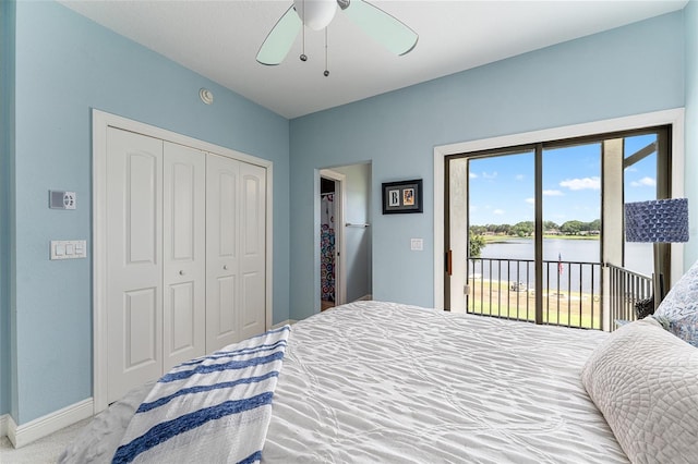 1111 Myrtle Breezes Ct, Fruitland Park, FL 34731 - bedroom featuring access to outside, a water view, a closet, baseboards, and carpet flooring
