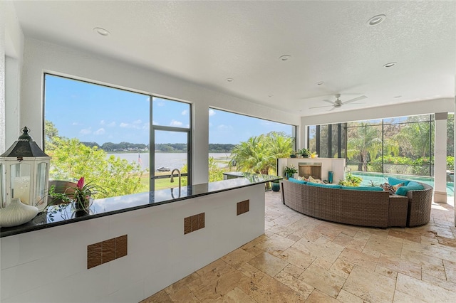 1111 Myrtle Breezes Ct, Fruitland Park, FL 34731 - sunroom / solarium featuring a water view and healthy amount of natural light