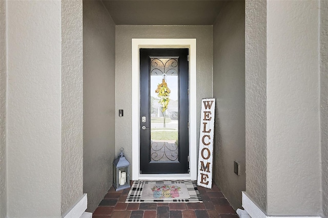 456 Winter Solstice Ln, Mount Dora, FL 32757 - view of exterior entry with stucco siding