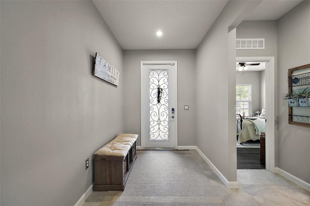 456 Winter Solstice Ln, Mount Dora, FL 32757 - foyer with baseboards, visible vents, and a ceiling fan