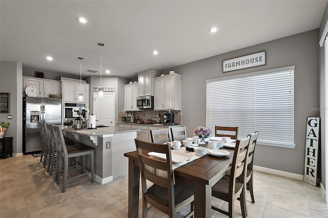 456 Winter Solstice Ln, Mount Dora, FL 32757 - dining room with light tile patterned flooring, baseboards, visible vents, and recessed lighting