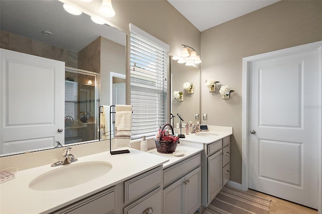 456 Winter Solstice Ln, Mount Dora, FL 32757 - bathroom featuring double vanity, tile patterned flooring, a shower stall, and a sink