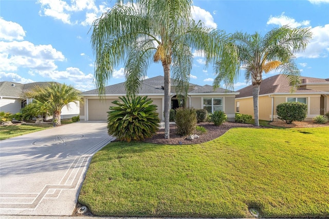 ranch-style home with a garage, stucco siding, driveway, and a front yard