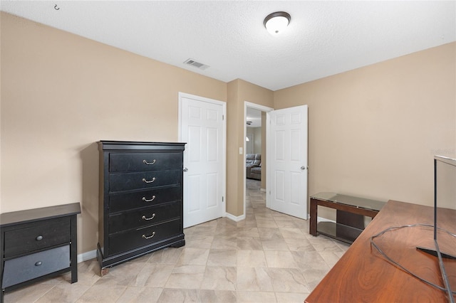 bedroom featuring visible vents and baseboards
