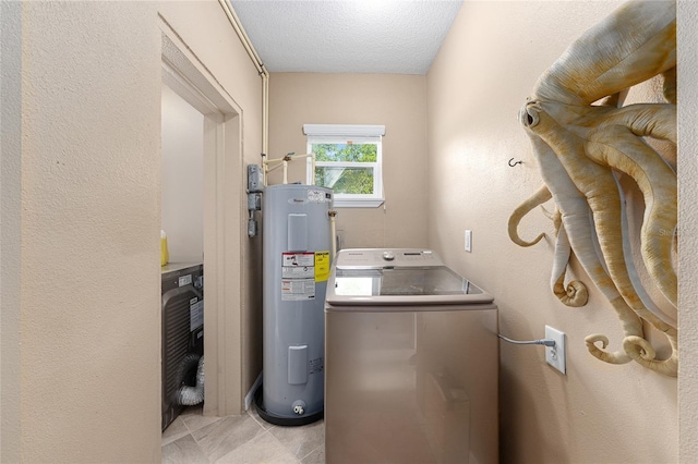 washroom with a textured ceiling, water heater, washer / clothes dryer, laundry area, and light tile patterned floors