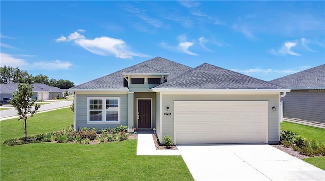 7796 SW 74th Loop, Ocala, FL 34481 - view of front of property with an attached garage, a shingled roof, a front yard, and concrete driveway