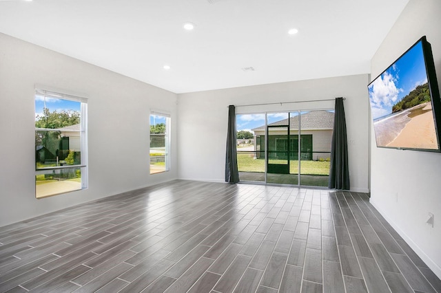 7796 SW 74th Loop, Ocala, FL 34481 - spare room with baseboards, a wealth of natural light, recessed lighting, and dark wood-style flooring