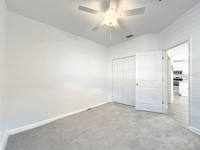 7796 SW 74th Loop, Ocala, FL 34481 - unfurnished bedroom featuring visible vents, baseboards, a closet, ceiling fan, and carpet floors