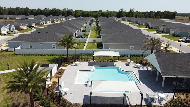 7796 SW 74th Loop, Ocala, FL 34481 - community pool with fence and a residential view