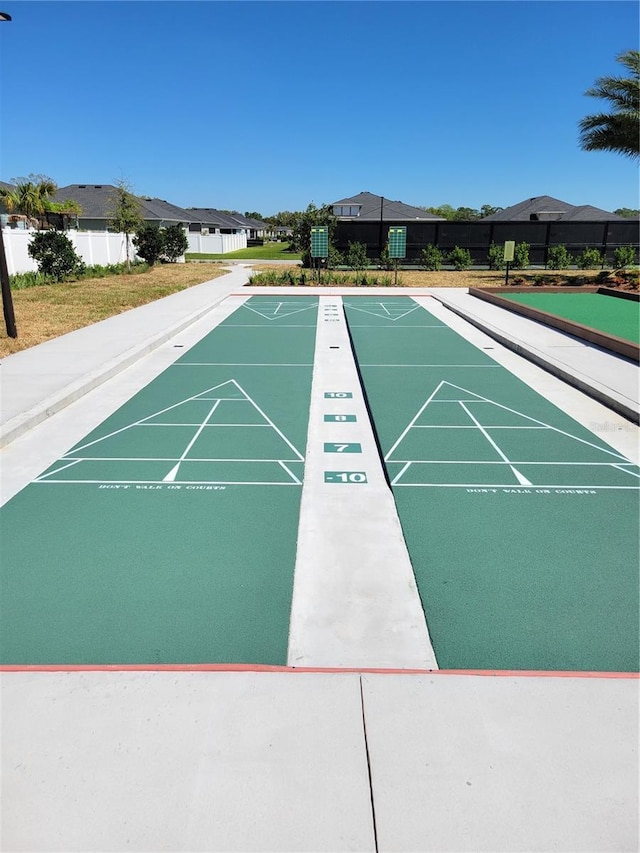 7796 SW 74th Loop, Ocala, FL 34481 - view of community featuring a yard, shuffleboard, and fence
