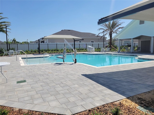 7796 SW 74th Loop, Ocala, FL 34481 - community pool with fence and a patio area