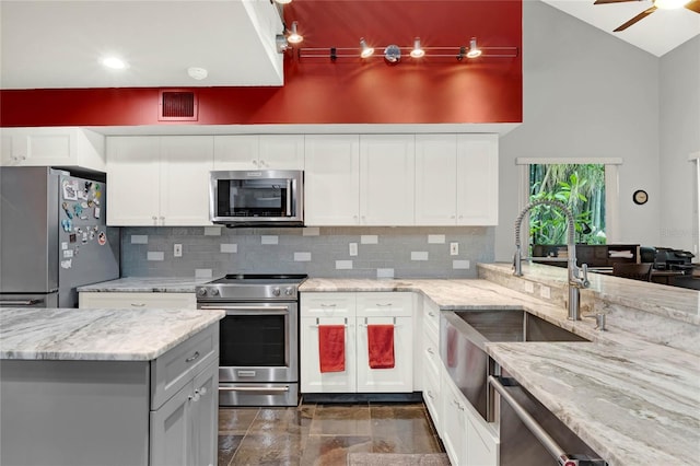 9642 Bear Lake Rd, Apopka, FL 32703 - kitchen featuring stainless steel appliances, visible vents, a sink, and tasteful backsplash