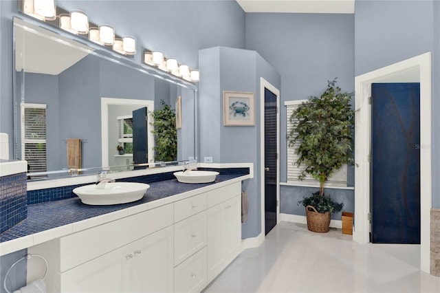 9642 Bear Lake Rd, Apopka, FL 32703 - bathroom featuring double vanity, a sink, and a wealth of natural light