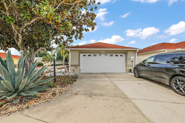 1323 Balboa Ct, The Villages, FL 32159 - exterior space featuring stucco siding, driveway, and a garage