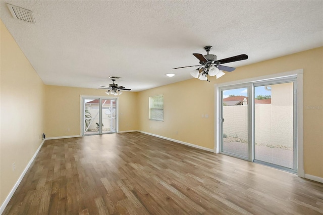1323 Balboa Ct, The Villages, FL 32159 - interior space with visible vents, ceiling fan, wood finished floors, and baseboards