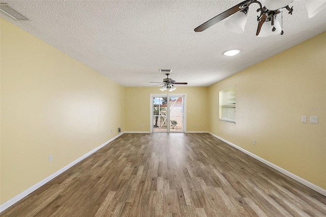 1323 Balboa Ct, The Villages, FL 32159 - spare room featuring baseboards, visible vents, wood finished floors, and a ceiling fan