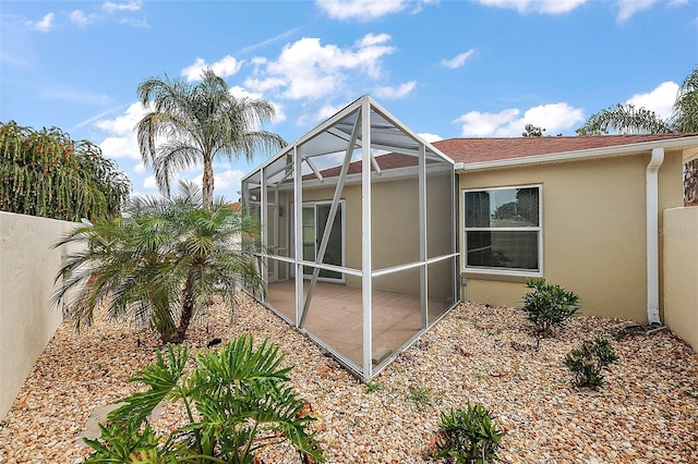 1323 Balboa Ct, The Villages, FL 32159 - back of property featuring a patio, stucco siding, and a lanai