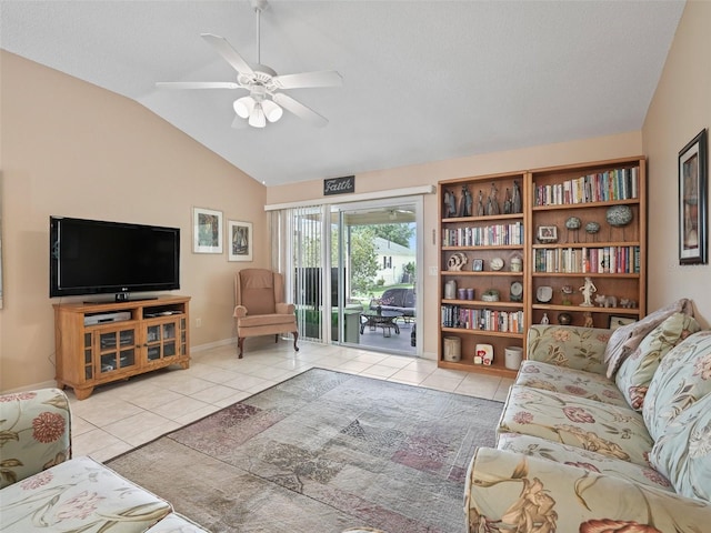 tiled living area featuring ceiling fan, vaulted ceiling, and baseboards