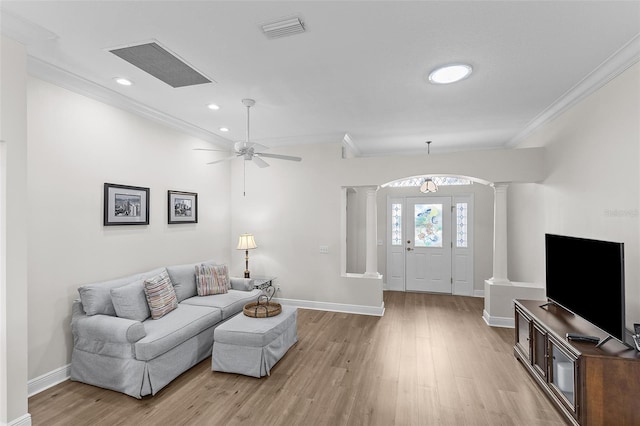 living area with visible vents, decorative columns, light wood-style flooring, and baseboards
