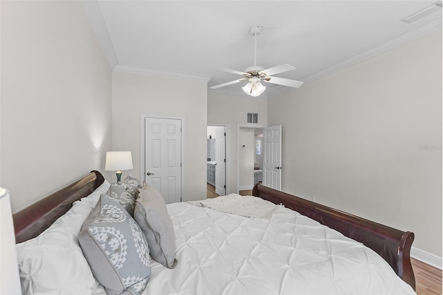 bedroom with ceiling fan, visible vents, baseboards, ornamental molding, and wood finished floors