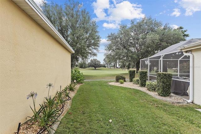 view of yard with a lanai