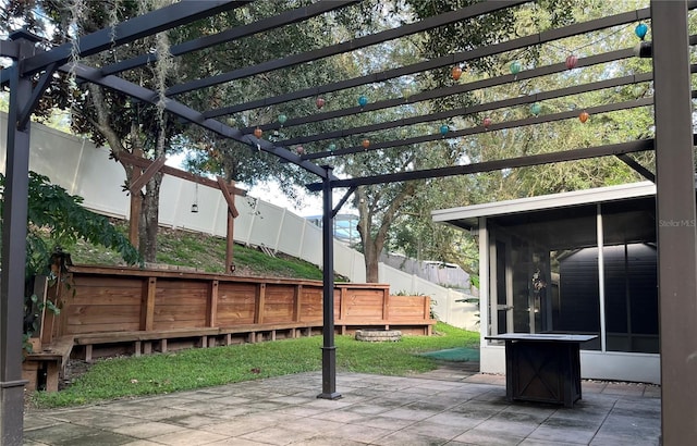 1307 Rain Forest Ln, Minneola, FL 34715 - fenced backyard with a pergola, a sunroom, and a patio
