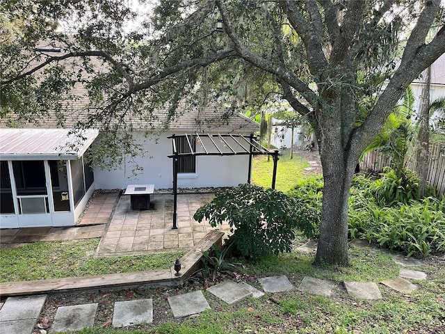 1307 Rain Forest Ln, Minneola, FL 34715 - fenced backyard with a sunroom and a patio