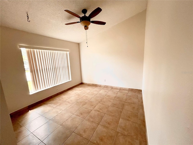 1307 Rain Forest Ln, Minneola, FL 34715 - empty room featuring tile patterned floors, a ceiling fan, and a textured ceiling